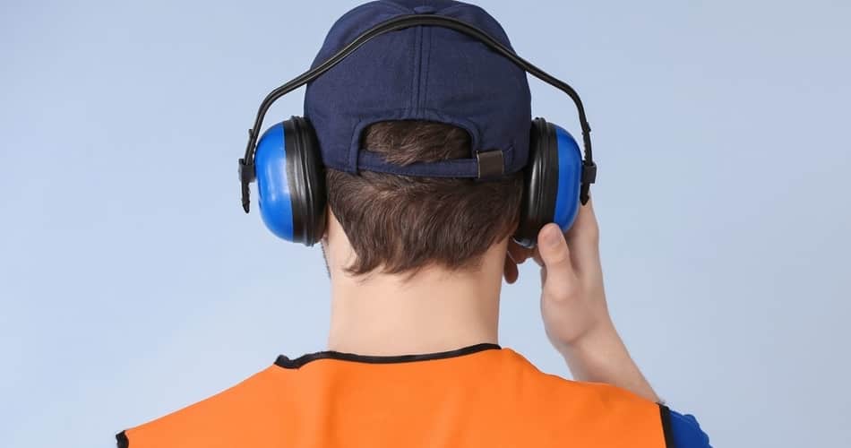 man wearing hearing protection because lawn mowers are louder than cars